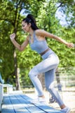 Young fit beautiful girl running outdoor up the stairs royalty free stock photo Young fit beautiful girl running outdoor up the stairs royalty free stock photo