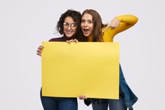 Young friends demonstrating empty banner stock images Young friends demonstrating empty banner stock images
