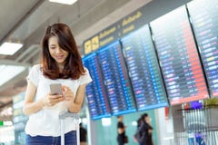 Young girl asian traveler using mobile smartphone stock image Young girl asian traveler using mobile smartphone stock image