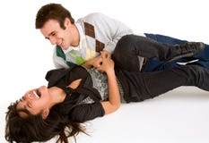 Young Girl being Tickled by Young Man royalty free stock photography Young Girl being Tickled by Young Man royalty free stock photography