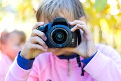 Young girl with camera in her hands_ royalty free stock photos Young girl with camera in her hands_ royalty free stock photos