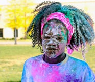Young girl covered in color at the color run