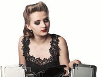 Portrait of a young girl in an elegant dress with a case with co Stock Image Portrait of a young girl in an elegant dress with a case with co Stock Image