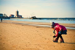 Young girl having fun on winter Baltic beach Royalty Free Stock Photos Young girl having fun on winter Baltic beach Royalty Free Stock Photos