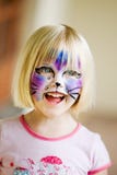 A young girl with her face painted royalty free stock images A young girl with her face painted royalty free stock images