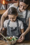 Girl and mother making salad royalty free stock photography Girl and mother making salad royalty free stock photography