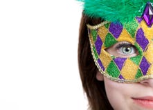 Young girl in a mardi gras mask with copy space stock images Young girl in a mardi gras mask with copy space stock images