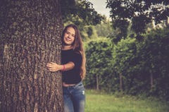 young girl near tree posing