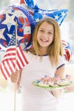 Young Girl Outdoors On Fourth Of July With Flag Young Girl Outdoors On Fourth Of July With Flag