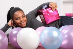 Young girl party time with present and balloons Royalty Free Stock Image Young girl party time with present and balloons Royalty Free Stock Image