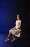 Young Girl Sitting On A Chair Royalty Free Stock Photography