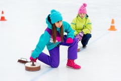 Young girls playing curling stock photos Young girls playing curling stock photos