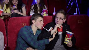 young-guys-relax-cinema-popcorn-drinks-two-non-traditional-orientation-sit-drink-cola-each-other-gay-men-145563588.jpg