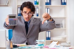 The young handsome businessman in budget planning concept stock photography The young handsome businessman in budget planning concept stock photography