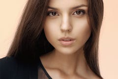 Close up of a brunette girl with seductive and natural make up, long hair, looking at camera, dressed in black. stock photography Close up of a brunette girl with seductive and natural make up, long hair, looking at camera, dressed in black. stock photography