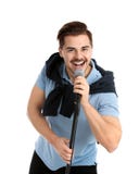 Young handsome man in casual clothes singing with microphone stock image Young handsome man in casual clothes singing with microphone stock image
