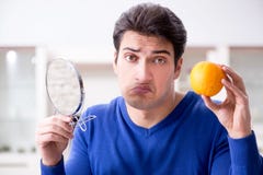 The young handsome man taking care of face skin royalty free stock photos The young handsome man taking care of face skin royalty free stock photos