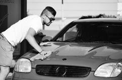 Young handsome man washing car Royalty Free Stock Photos Young handsome man washing car Royalty Free Stock Photos