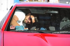 Young handsome man washing car Stock Images Young handsome man washing car Stock Images