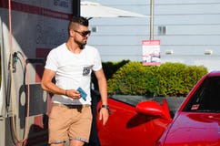 Young handsome man washing car Royalty Free Stock Photography Young handsome man washing car Royalty Free Stock Photography