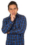 Young handsome man wearing a blue plaid shirt. Posing with hand on chin isolated on white Stock Photography Young handsome man wearing a blue plaid shirt. Posing with hand on chin isolated on white Stock Photography