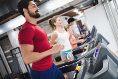 Young handsome man doing cardio training in gym royalty free stock photos Young handsome man doing cardio training in gym royalty free stock photos