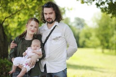 Young happy family at summer stock photos Young happy family at summer stock photos