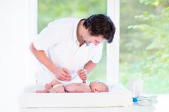 Young happy father playing with his newborn baby son royalty free stock images Young happy father playing with his newborn baby son royalty free stock images