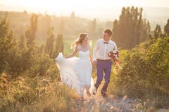 https://thumbs.dreamstime.com/t/young-happy-just-married-couple-posing-top-mountain-wedding-day-62107797.jpg