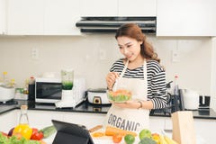 Young happy woman eating salad. Healthy lifestyle with green foo Stock Photography Young happy woman eating salad. Healthy lifestyle with green foo Stock Photography