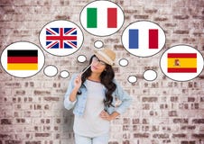young happy woman thinking in main languages. Bricks wall background royalty free stock photo young happy woman thinking in main languages. Bricks wall background royalty free stock photo