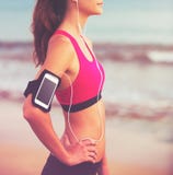 Young Healthy Fitness Woman with Smart Phone royalty free stock photos Young Healthy Fitness Woman with Smart Phone royalty free stock photos