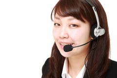 Young Japanese businesswoman of call center with head sets stock photography Young Japanese businesswoman of call center with head sets stock photography