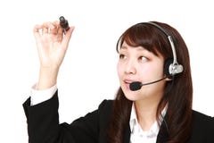 Young Japanese businesswoman draw in the air stock image Young Japanese businesswoman draw in the air stock image
