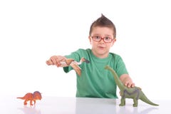 Young kid playing with dinosaurs