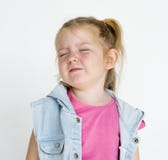 Young little girl with awkward smile expression portrait royalty free stock image Young little girl with awkward smile expression portrait royalty free stock image