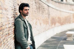 Young male fashion street on wall Royalty Free Stock Image Young male fashion street on wall Royalty Free Stock Image