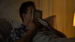 Young male kissing photo with girlfriend, missing beloved, business trip stock video footage Young male kissing photo with girlfriend, missing beloved, business trip stock video footage