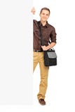 Young male student standing behind a panel royalty free stock photos Young male student standing behind a panel royalty free stock photos