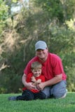 Young Man And Boy At Park Royalty Free Stock Photography Young Man And Boy At Park Royalty Free Stock Photography