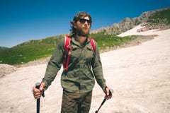 Young Man with backpack hiking outdoor Travel Lifestyle concept stock photo Young Man with backpack hiking outdoor Travel Lifestyle concept stock photo