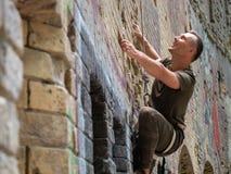 Young man bouldering outdoor climbing. stock photography Young man bouldering outdoor climbing. stock photography