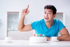 The young man celebrating birthday alone at home royalty free stock image The young man celebrating birthday alone at home royalty free stock image