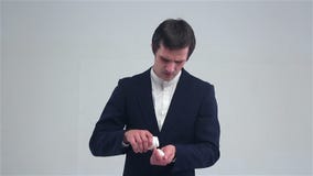 A young man eating a pill for a headache stock video footage A young man eating a pill for a headache stock video footage