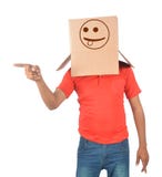 Young man gesturing with a cardboard box on his head with naught stock photos Young man gesturing with a cardboard box on his head with naught stock photos