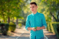 Young man holding casual popular gadget fidget spinner. stock photos Young man holding casual popular gadget fidget spinner. stock photos