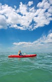Young Man In Sea Kayak Under Dramatic Skies Royalty Free Stock Images Young Man In Sea Kayak Under Dramatic Skies Royalty Free Stock Images