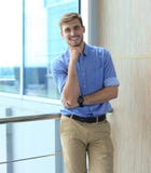 Young man looking at the camera in his office. Royalty Free Stock Photos Young man looking at the camera in his office. Royalty Free Stock Photos