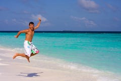 Young Man On A Tropical Beach Stock Photography