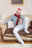 The young man ornate with Christmas decorations and red hat royalty free stock images The young man ornate with Christmas decorations and red hat royalty free stock images